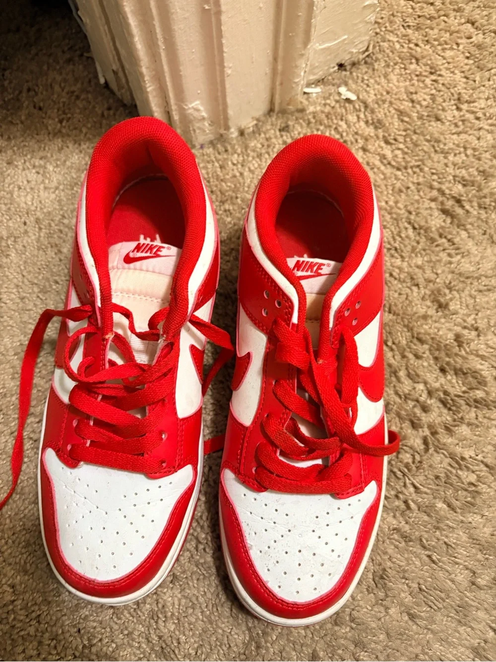 Nike Kids Red and White Low-Top Sneakers with Bold Swoosh